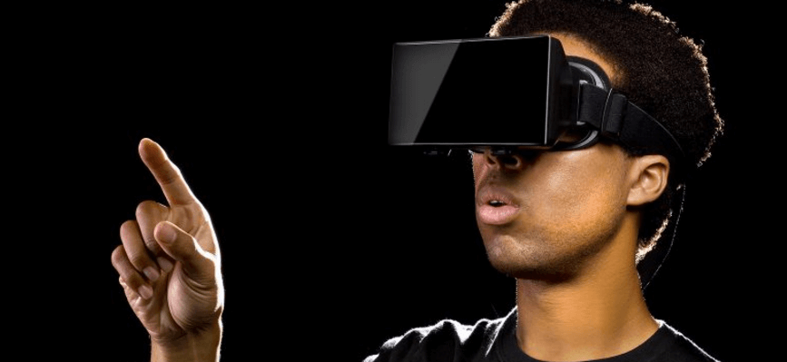 Young man using virtual reality software